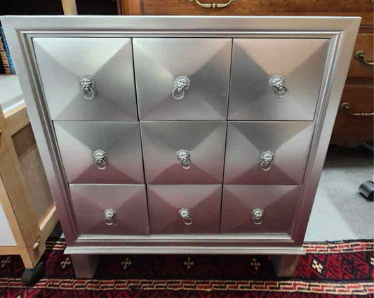Silver 9 Drawer Lion Pull Cabinet