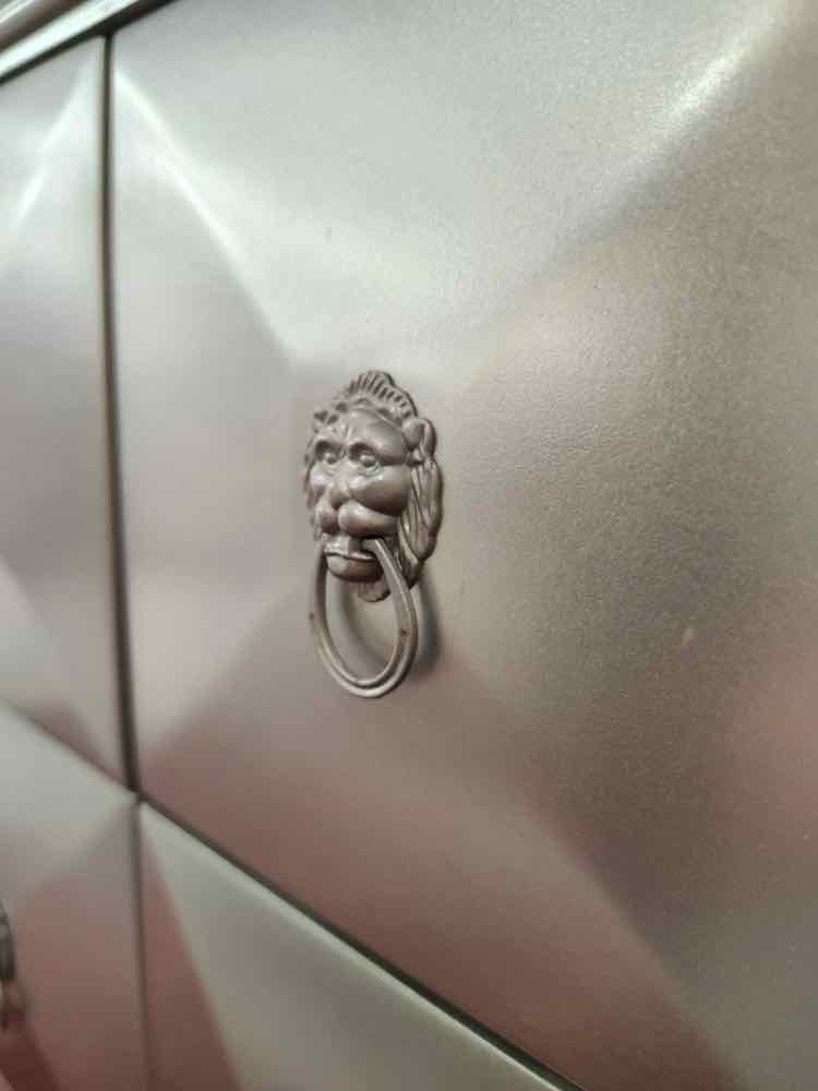 Silver 9 Drawer Lion Pull Cabinet
